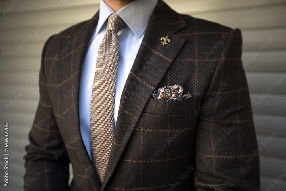 Man in elegant tailored suit posing - essential item 